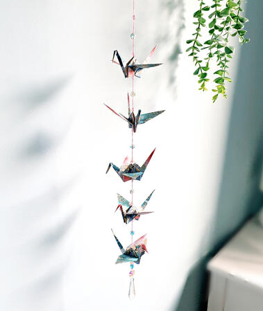 Handmade Hanging Origami Paper Cranes threaded with beads and a prism suncatcher